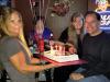 Bourbon St. owner Gretchen presents Denny with a cool Elvis b’day cake as Terry looks on.